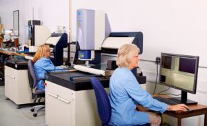 two women sitting at machines